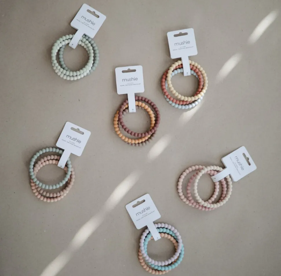 mushie_pearl_teether_brac_1.webp Mushie Pearl Teether Bracelets - Berry / Marigold / Khaki